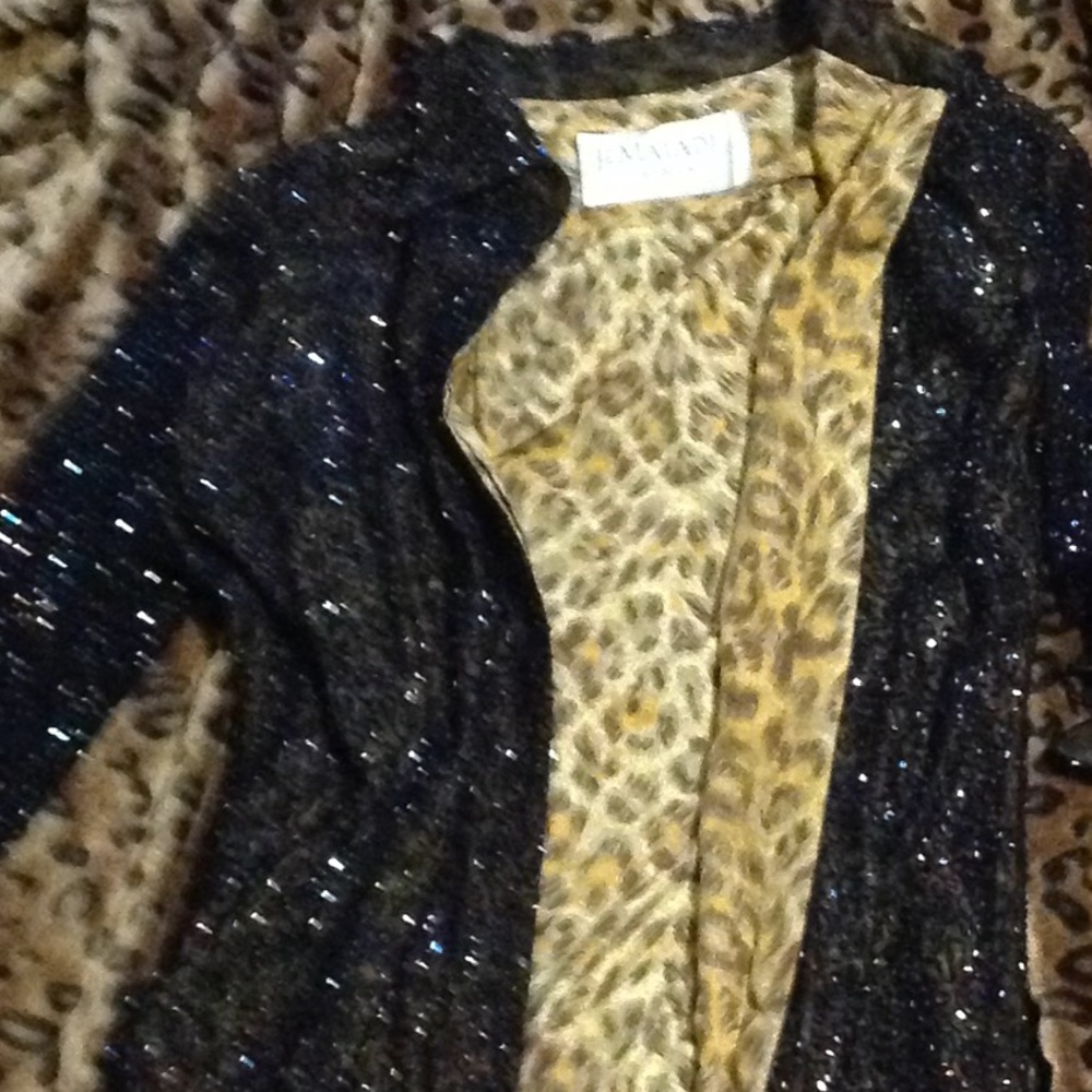 Can be worn as a button up dress or a Jacket.